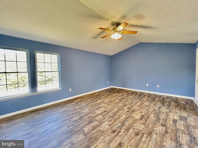 full bathroom with hardwood / wood-style floors, vanity, bathtub / shower combination, and toilet