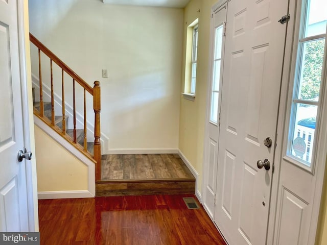 foyer entrance with dark hardwood / wood-style flooring