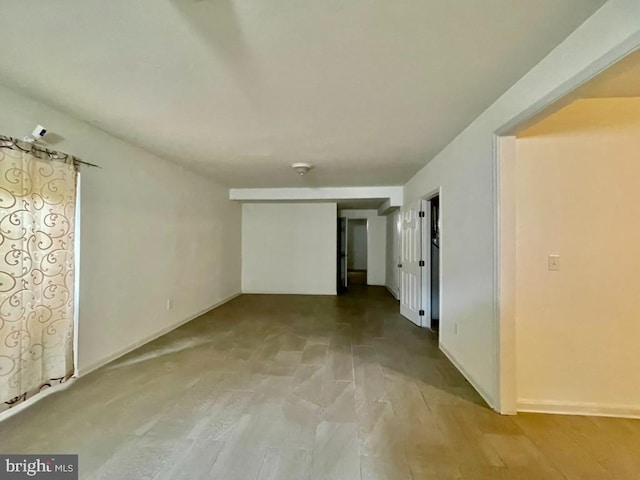 interior space featuring baseboards