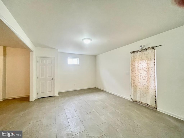 empty room with baseboards