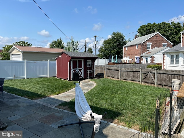 view of yard with a shed and a patio