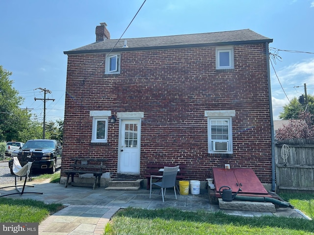 back of house with a patio