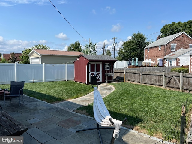 view of yard featuring a patio area and a storage shed