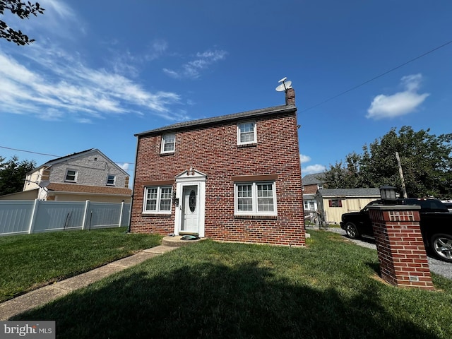 view of front of home with a front lawn