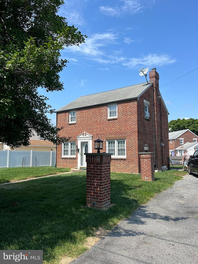 view of front of home with a front yard