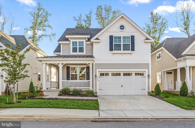 view of front of home featuring a garage and a porch