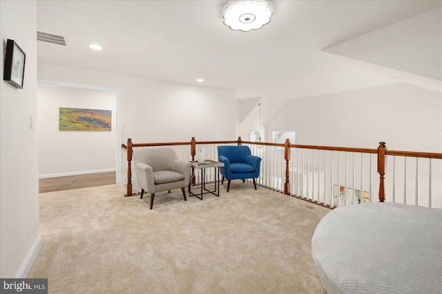 living area featuring carpet, visible vents, baseboards, and recessed lighting