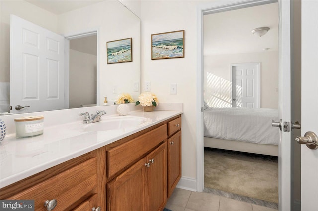 ensuite bathroom featuring ensuite bath, tile patterned flooring, and vanity