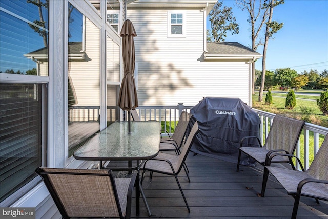 wooden terrace featuring outdoor dining space