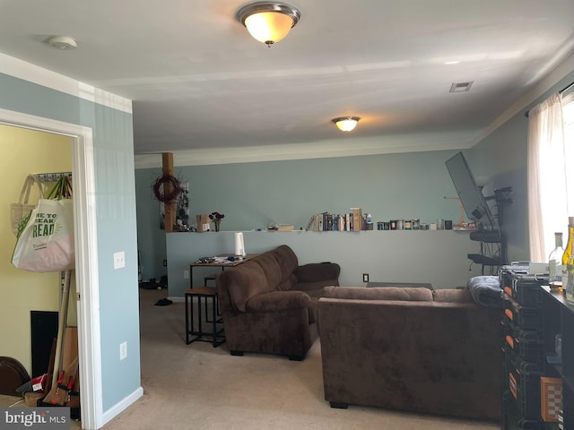 living room featuring carpet and crown molding