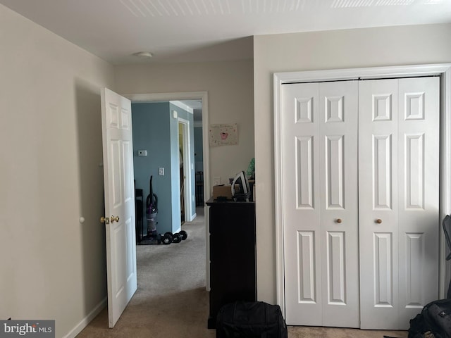 bedroom featuring a closet and carpet floors