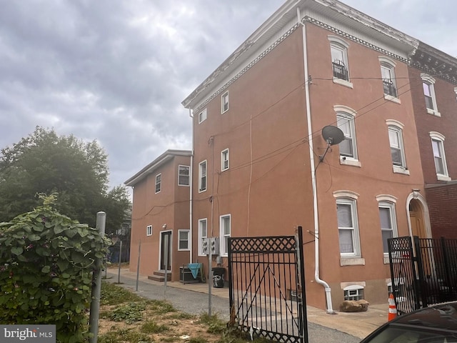 view of property featuring central AC unit