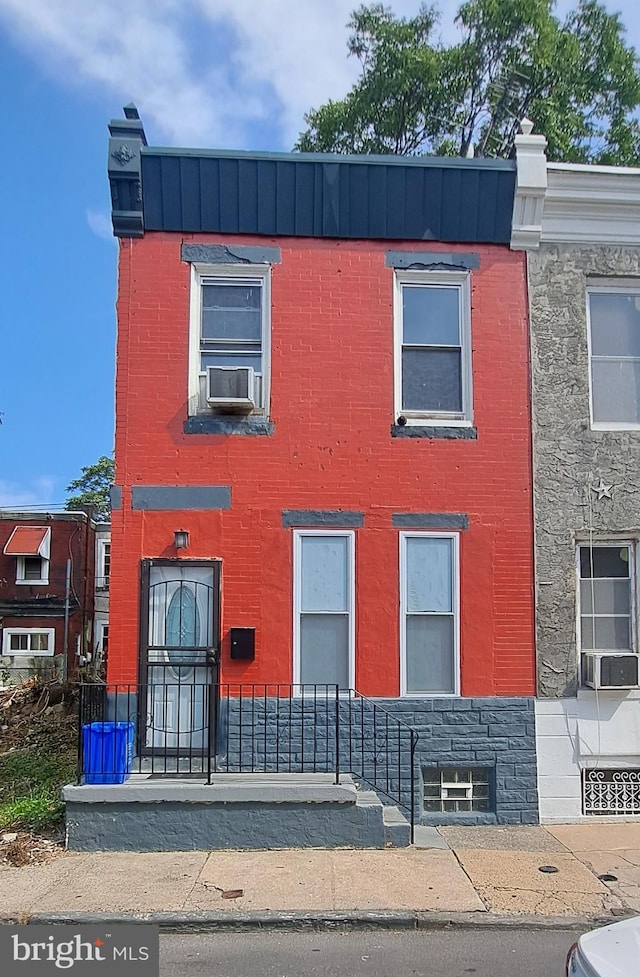 view of front facade featuring cooling unit