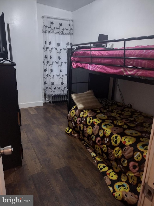 bedroom featuring dark hardwood / wood-style floors