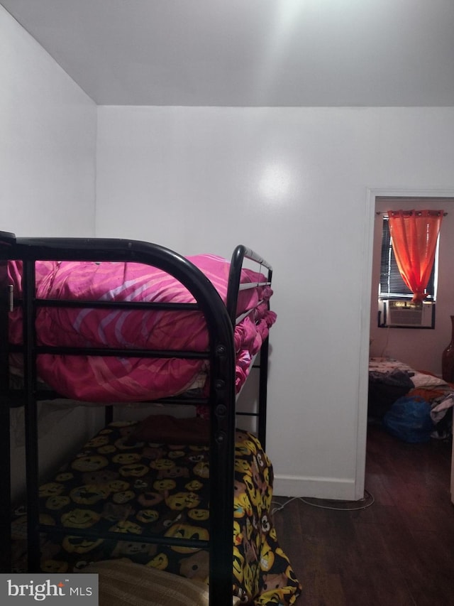 bedroom with wood-type flooring