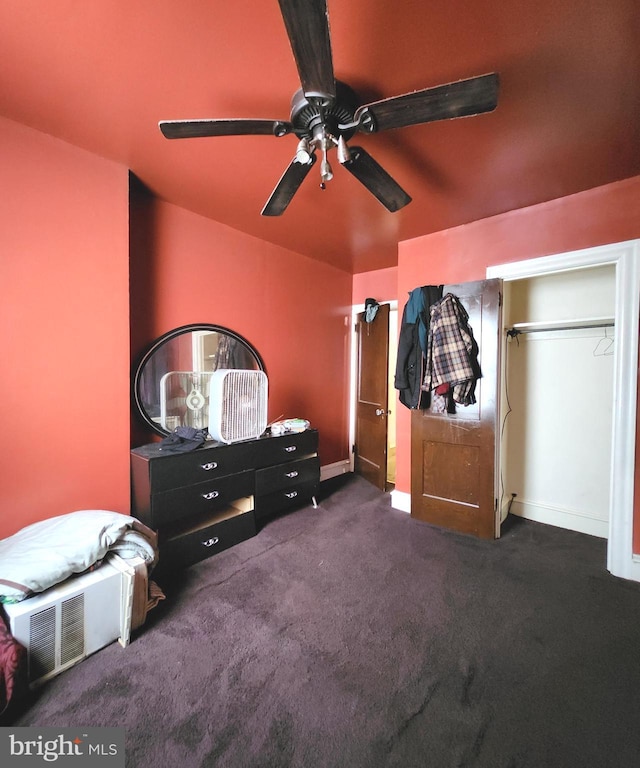 carpeted bedroom with a closet and ceiling fan