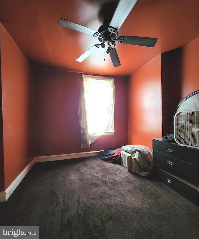 unfurnished bedroom with ceiling fan and carpet flooring