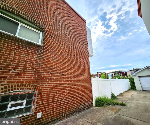 view of side of property with an outbuilding and a garage