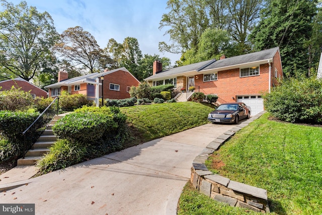 single story home featuring a front yard, an attached garage, a chimney, brick siding, and driveway