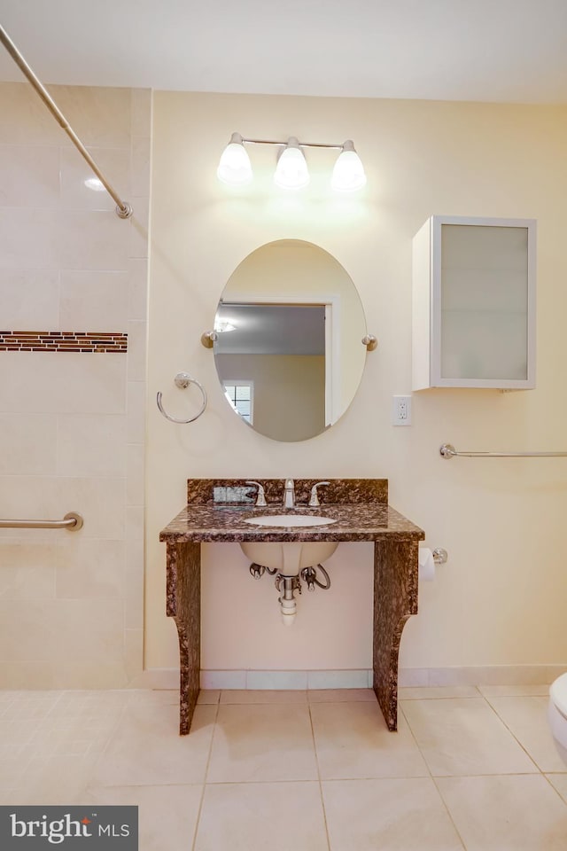 bathroom with sink and tile patterned floors