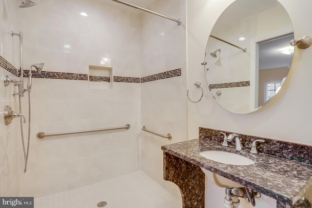 bathroom featuring sink and tiled shower