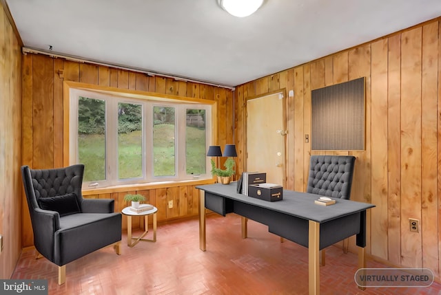 office area featuring wood walls