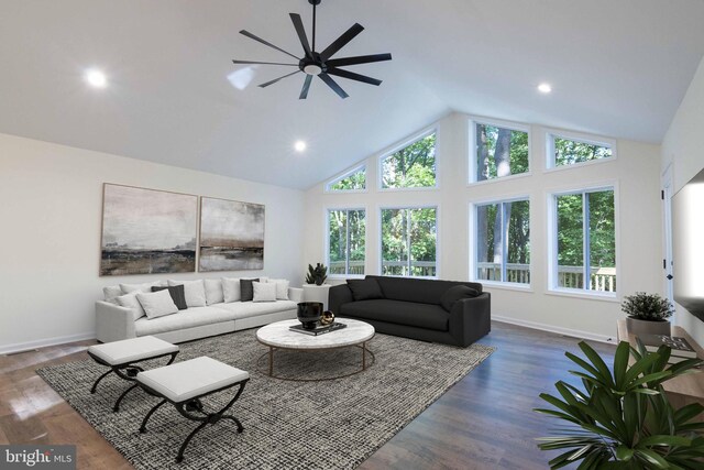 living room featuring ceiling fan, dark hardwood / wood-style floors, and high vaulted ceiling