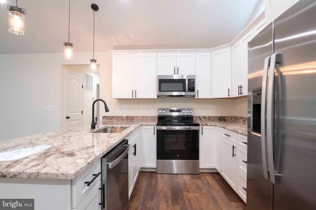 kitchen featuring appliances with stainless steel finishes, white cabinetry, sink, and dark hardwood / wood-style floors