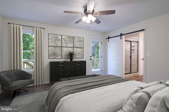 bedroom with a barn door, ceiling fan, and wood-type flooring