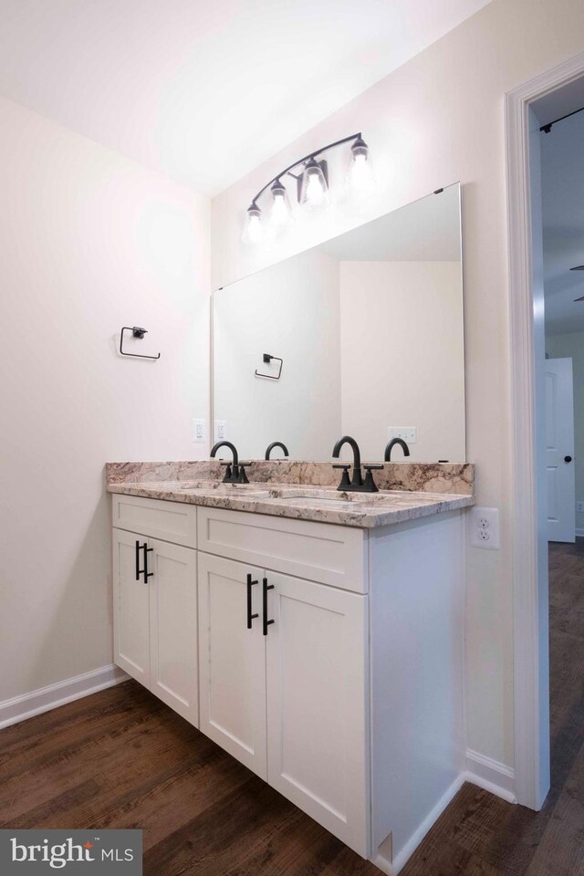 bathroom featuring hardwood / wood-style floors and vanity