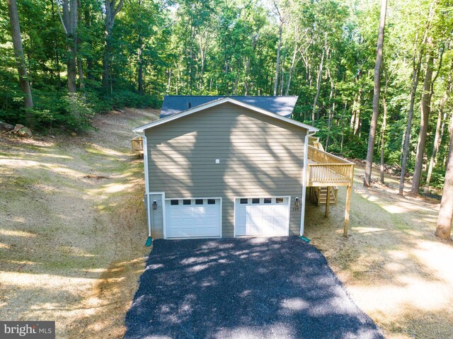 view of side of property featuring a garage