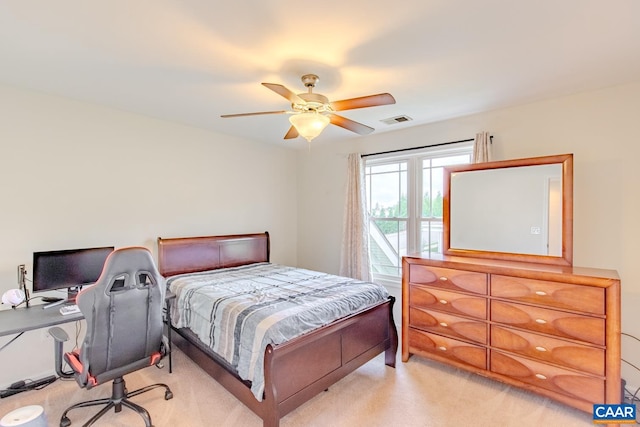 bedroom featuring ceiling fan and light colored carpet