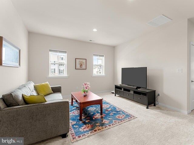 living room featuring light colored carpet