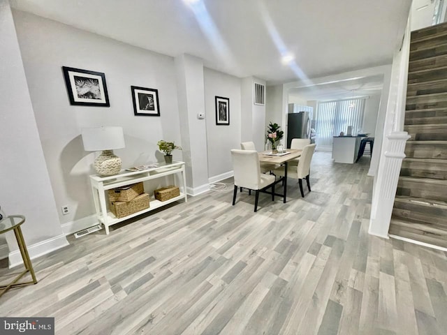 dining room featuring light hardwood / wood-style flooring