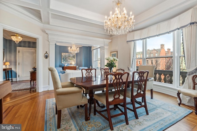 dining area featuring crown molding, a chandelier, beamed ceiling, coffered ceiling, and wood-type flooring