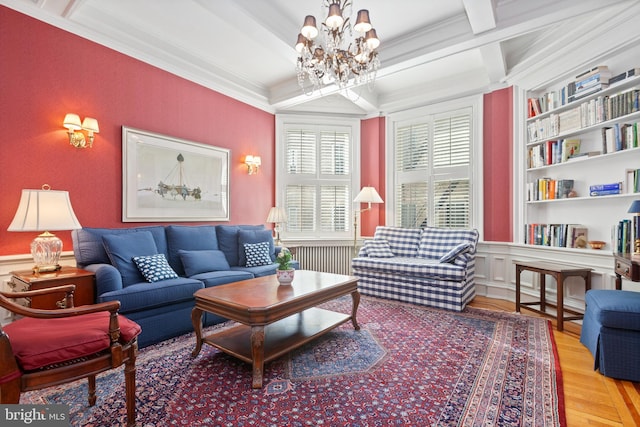 living room with light wood-type flooring, coffered ceiling, a notable chandelier, crown molding, and beam ceiling