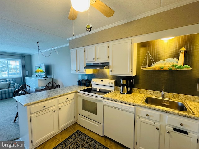 kitchen with white appliances, white cabinets, a peninsula, under cabinet range hood, and a sink