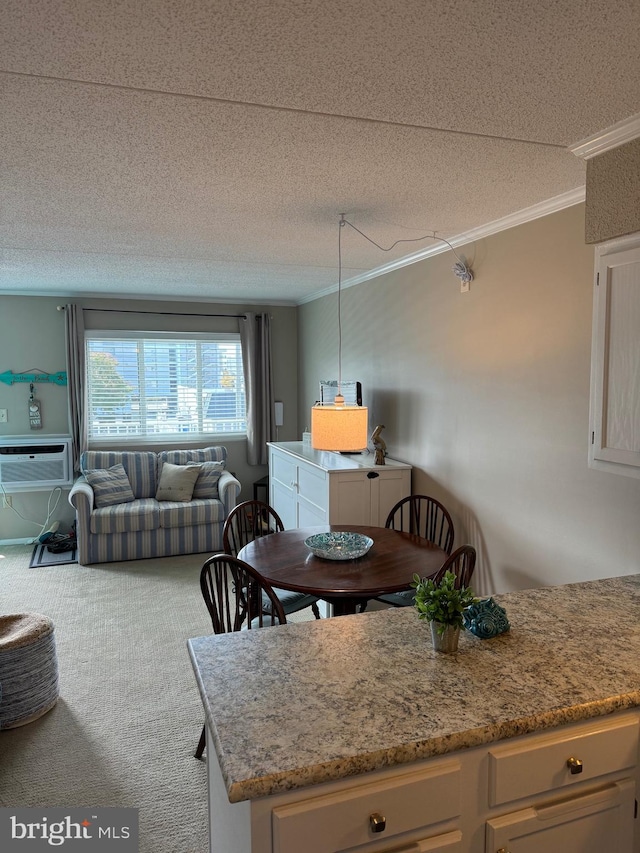 kitchen featuring carpet floors, crown molding, a wall mounted AC, open floor plan, and a textured ceiling