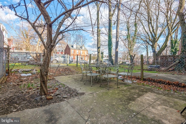 view of patio / terrace featuring outdoor dining space and fence