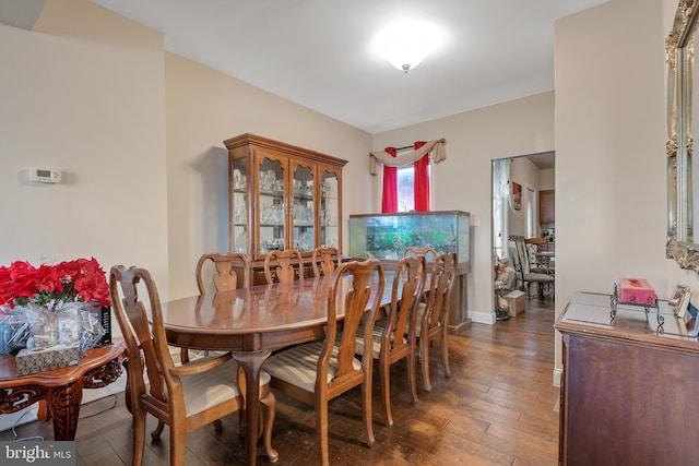 dining room with dark hardwood / wood-style floors