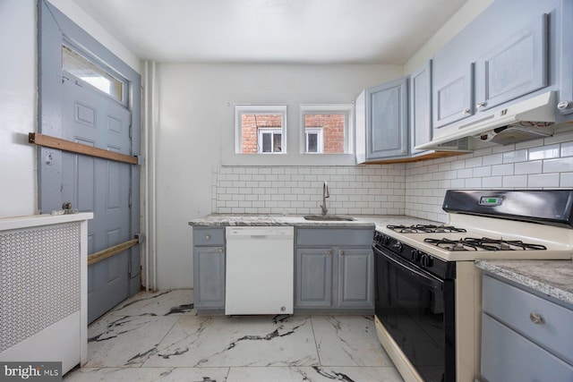 kitchen with gray cabinets, white appliances, sink, and decorative backsplash