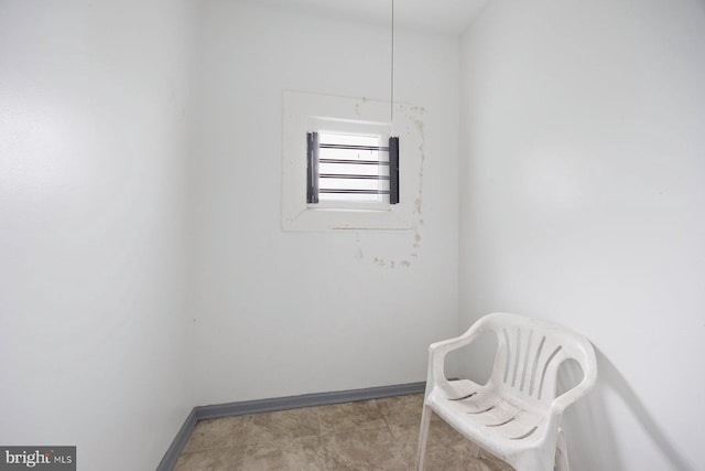 living area with light tile patterned floors