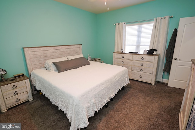 bedroom featuring dark carpet