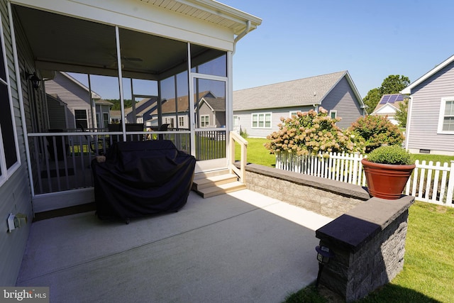 view of patio featuring ceiling fan