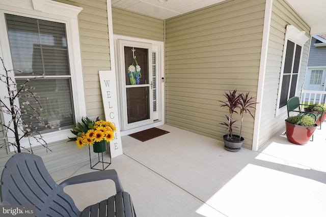 entrance to property featuring a porch