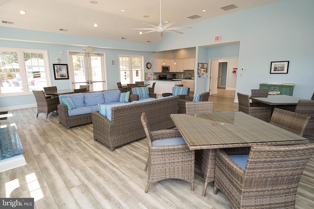 dining area featuring ceiling fan, light hardwood / wood-style floors, and french doors