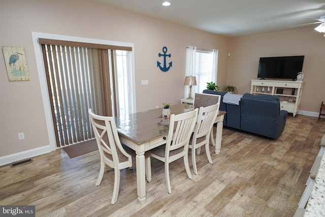 dining room featuring ceiling fan and hardwood / wood-style flooring