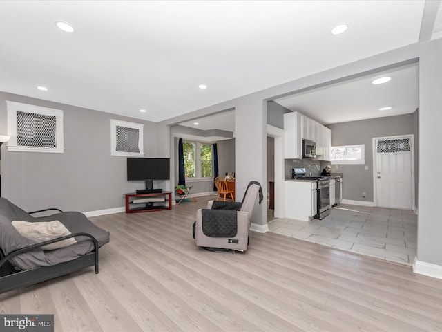 living room with light hardwood / wood-style flooring