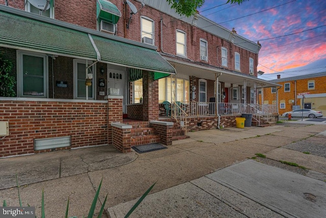 view of property with a porch