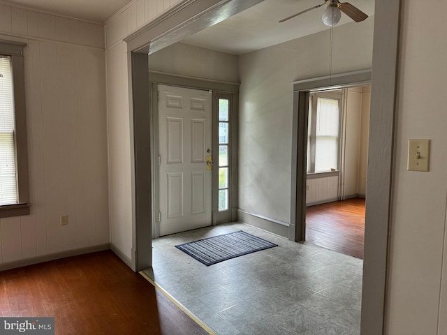 foyer with hardwood / wood-style floors and ceiling fan